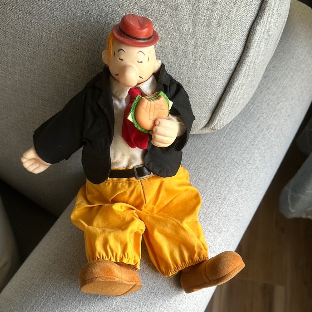 Red and Black Vintage Clown Figurine with Striking Outfit